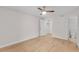 Spacious bedroom with ceiling fan and doorway to a bathroom and closet at 2213 Grand Cayman Ct # 1138, Kissimmee, FL 34741