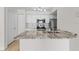 Modern kitchen featuring granite countertops and stainless steel appliances, blending style and functionality for cooking at 2213 Grand Cayman Ct # 1138, Kissimmee, FL 34741