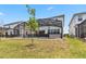 Spacious backyard with a screened pool area offering a private oasis at 2574 Shanti Dr, Kissimmee, FL 34746