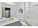 Bathroom with a shower/tub, toilet, vanity with mirror, and Minion decor at 2574 Shanti Dr, Kissimmee, FL 34746