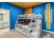 Bright bedroom features a bunk bed with stairs and a pull-out bed, plus a unique design at 2574 Shanti Dr, Kissimmee, FL 34746