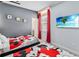 This bedroom features two beds, a TV, and an ensuite bathroom at 2574 Shanti Dr, Kissimmee, FL 34746