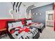 Fun bedroom features two beds, Mickey Mouse decor, and an attached bathroom at 2574 Shanti Dr, Kissimmee, FL 34746