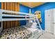 Cheerful bedroom features a bunk bed, yellow accents, and whimsical Minion decorations at 2574 Shanti Dr, Kissimmee, FL 34746