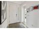 Bright entryway featuring a white door with decorative glass and modern decor at 2574 Shanti Dr, Kissimmee, FL 34746