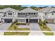 Stunning aerial showcases the home's modern design, two-car garage, and manicured landscaping at 2574 Shanti Dr, Kissimmee, FL 34746
