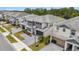 Aerial view shows modern home, two-car garage, and beautifully landscaped yard in a desirable community at 2574 Shanti Dr, Kissimmee, FL 34746