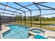 Stunning screened pool and hot tub offer serene water views, perfect for relaxation and entertainment at 2574 Shanti Dr, Kissimmee, FL 34746