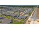 An aerial view of a neighborhood with similar-style homes and community landscaping at 2591 Seagirt Way, Clermont, FL 34711
