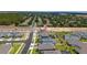 Aerial view showcasing a neighborhood with various homes and a pool at 2591 Seagirt Way, Clermont, FL 34711