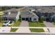 This is an aerial view of a charming single-Gathering home featuring a two-car garage and well-manicured lawn at 2591 Seagirt Way, Clermont, FL 34711