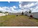Fenced backyard with an outdoor grill and a bit of grass at 2591 Seagirt Way, Clermont, FL 34711