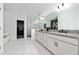 Beautiful bathroom with double vanity, granite counters and glass enclosed shower at 2591 Seagirt Way, Clermont, FL 34711