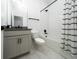 Bathroom features a modern vanity and tiled shower at 2591 Seagirt Way, Clermont, FL 34711