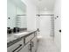 Bathroom features a modern vanity and tiled shower at 2591 Seagirt Way, Clermont, FL 34711