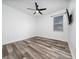 A bright bedroom with a modern ceiling fan, and a mounted TV at 2591 Seagirt Way, Clermont, FL 34711