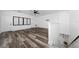 Large bonus room with hardwood floors, windows, and stairs at 2591 Seagirt Way, Clermont, FL 34711