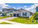 Beautiful home featuring a two-car garage and lush green landscaping at 2591 Seagirt Way, Clermont, FL 34711
