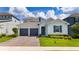 Charming single-Gathering home with a two-car garage and manicured lawn at 2591 Seagirt Way, Clermont, FL 34711