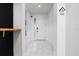 Clean and bright hallway with tile flooring leading to the front door at 2591 Seagirt Way, Clermont, FL 34711