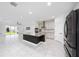 Open-concept kitchen with a large island and stainless steel appliances at 2591 Seagirt Way, Clermont, FL 34711