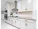 Modern kitchen with white cabinets and stainless steel appliances at 2591 Seagirt Way, Clermont, FL 34711