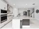 Spacious kitchen featuring an island, stainless appliances, and ample counter space at 2591 Seagirt Way, Clermont, FL 34711