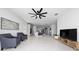 Bright living room with tile floors, and seamless flow into the modern kitchen at 2591 Seagirt Way, Clermont, FL 34711