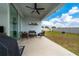 Covered patio with ceiling fan and furniture, ideal for outdoor relaxation and enjoyment at 2591 Seagirt Way, Clermont, FL 34711