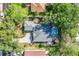 Aerial view of the property featuring a pool, patio, and backyard at 2623 Gables Dr, Eustis, FL 32726