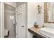 Beautiful bathroom featuring a custom vanity, walk-in shower, and modern fixtures at 2623 Gables Dr, Eustis, FL 32726