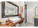 Stylist bathroom featuring a big mirror and floral decorations at 2623 Gables Dr, Eustis, FL 32726