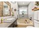 Charming bathroom featuring vanity sink, bathtub, and decorative elements at 2623 Gables Dr, Eustis, FL 32726