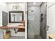 Stylish bathroom featuring vessel sink, wood counter, decorative tile, and glass shower enclosure at 2623 Gables Dr, Eustis, FL 32726