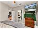 The bedroom has a TV, access to a bathroom and views of the living space at 2623 Gables Dr, Eustis, FL 32726