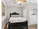 This bedroom has a ceiling fan and simple design with hardwood floors at 2623 Gables Dr, Eustis, FL 32726