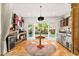 Charming bonus room with a round table, beverage coolers, and doors leading to the outdoor pool area at 2623 Gables Dr, Eustis, FL 32726