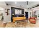 Comfortable living room with stylish decor, a large picture, and easy access to the dining and kitchen areas at 2623 Gables Dr, Eustis, FL 32726