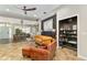 Spacious living room with a plush sofa, a dining area, and an open floor plan at 2623 Gables Dr, Eustis, FL 32726