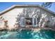 Relaxing pool area with outdoor seating and a beautiful view of the home's exterior, offering a perfect retreat at 2623 Gables Dr, Eustis, FL 32726