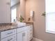 Bathroom featuring a white vanity with granite countertop and a square vessel sink at 2660 Sunrise Shores Dr, Kissimmee, FL 34747