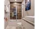 Bathroom featuring a shower with glass door, a white vanity and a Frozen II poster at 2660 Sunrise Shores Dr, Kissimmee, FL 34747