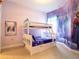 Charming bedroom featuring a bunk bed and vibrant Frozen-themed decor at 2660 Sunrise Shores Dr, Kissimmee, FL 34747