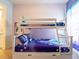 Charming ' bedroom featuring 'Frozen' themed bedding and bunk beds with light purple walls at 2660 Sunrise Shores Dr, Kissimmee, FL 34747