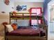 Fun bedroom with a wooden bunk bed and playful Harry Potter wall decor at 2660 Sunrise Shores Dr, Kissimmee, FL 34747