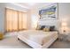 Bright bedroom featuring modern decor, white walls, large window, and carpet at 2660 Sunrise Shores Dr, Kissimmee, FL 34747
