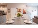 Dining area with seating for six, stainless steel appliances in view, and charming decorative accents at 2660 Sunrise Shores Dr, Kissimmee, FL 34747