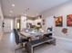 Bright dining room featuring a concrete table, unique seating, and modern decor at 2660 Sunrise Shores Dr, Kissimmee, FL 34747