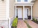 Inviting home entrance with stone accents and well-maintained landscaping at 2660 Sunrise Shores Dr, Kissimmee, FL 34747