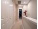 Upstairs hallway with neutral walls, carpet and fun superhero decorations on the walls at 2660 Sunrise Shores Dr, Kissimmee, FL 34747